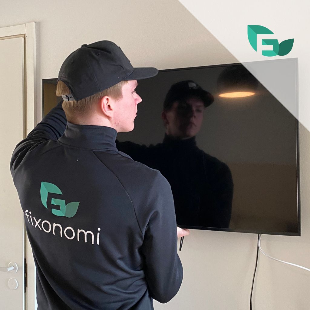 TV-asennus seinälle ammattiasentajan toimesta - televisio kiinnitetty tukevasti seinään